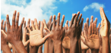 African-American Hands reaching into a blue sky