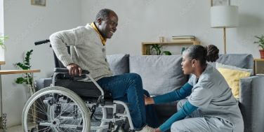 a nurse assisting her patient who is in a wheelchair