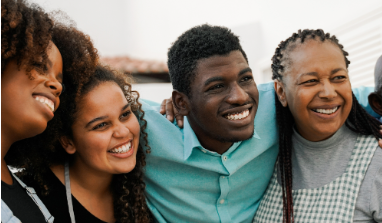 a group of young adults smiling at the camera