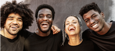 a group of young adults smiling and posing for a photo